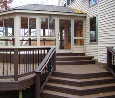 Beautiful custom deck with railings and stairs at a residential home in Oakland County